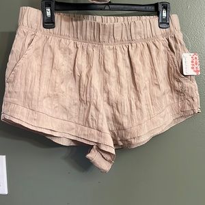 New with tags, Free people shorts. Size med. tan color with pockets.